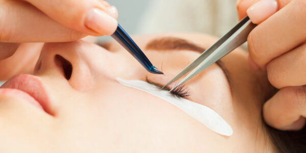 Woman with long eyelashes in a beauty salon during eyelash extension Woman with long eyelashes in a beauty salon during eyelash extension. Beauty concept